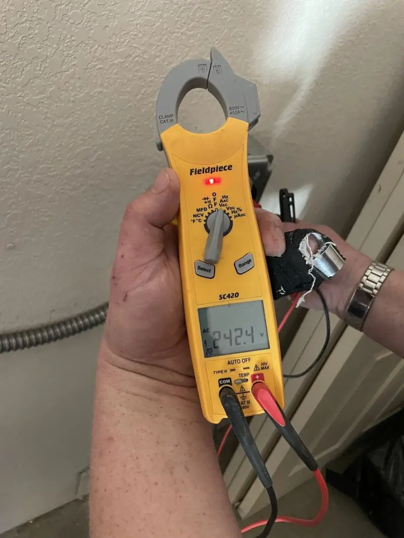 Voltage testing with clamp meter during Ceiling Fan Installation in Morrisville